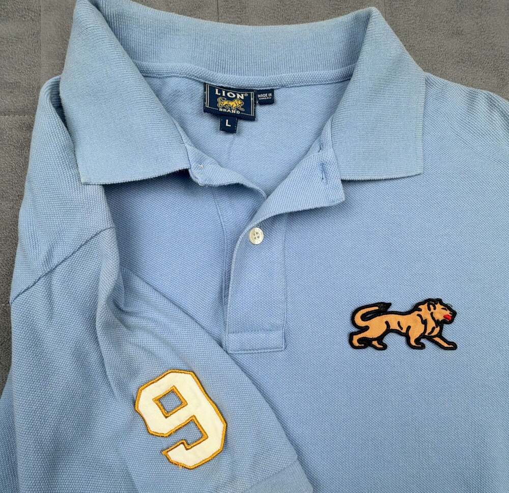 90’s Vintage Lion Brand Light Blue Polo Shirt with Patch, Size L